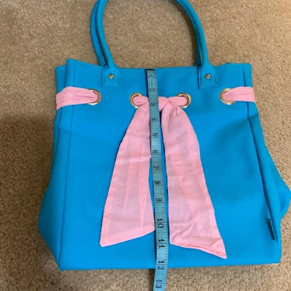 Cute bag. Blue with pink ribbon. Ralph tag. 12